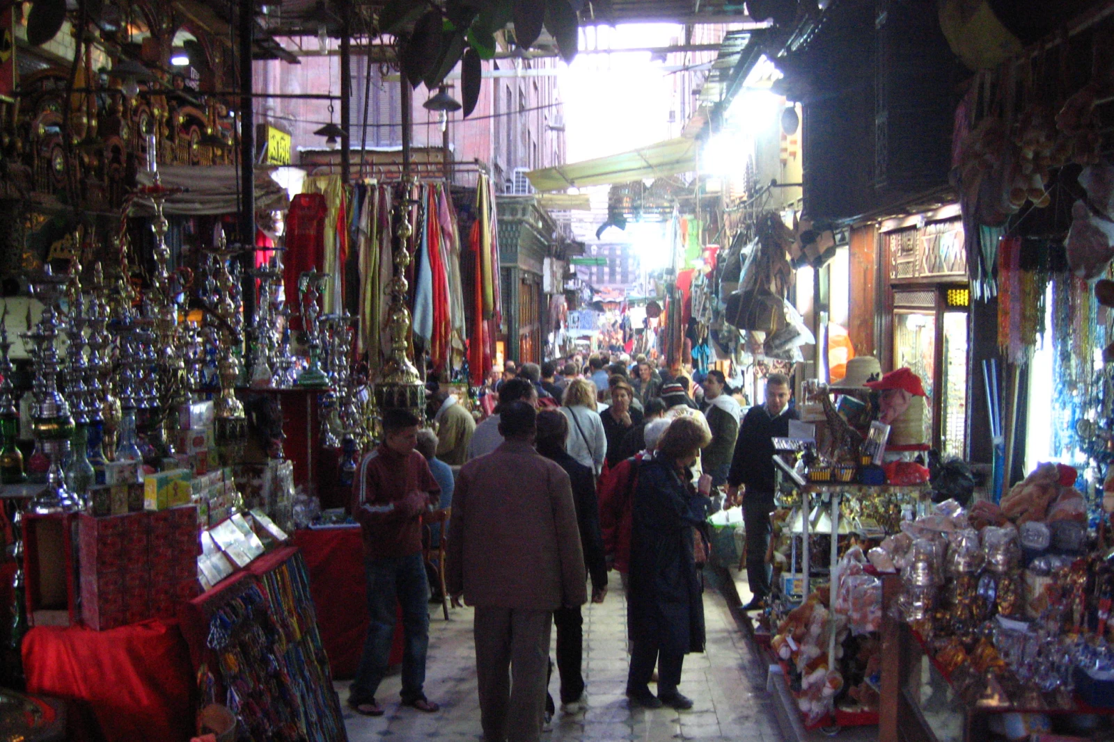 A narrow market lane with goods on display in Cairo