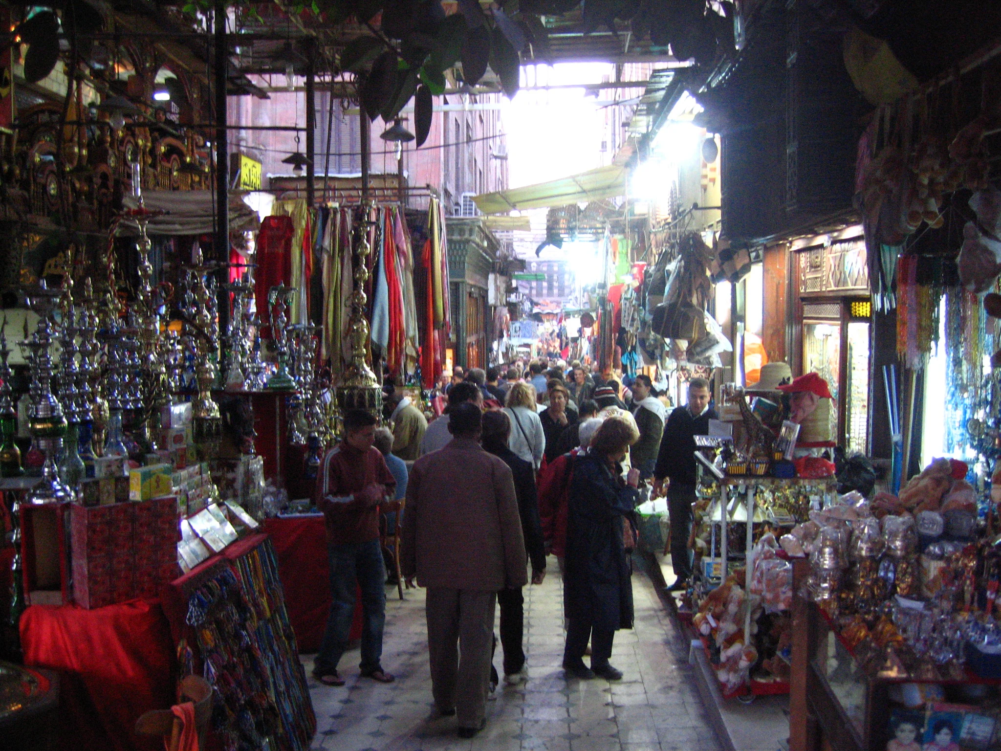 A narrow market lane with goods on display in Cairo